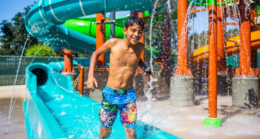 Visit Visalia teen boy getting off water ride