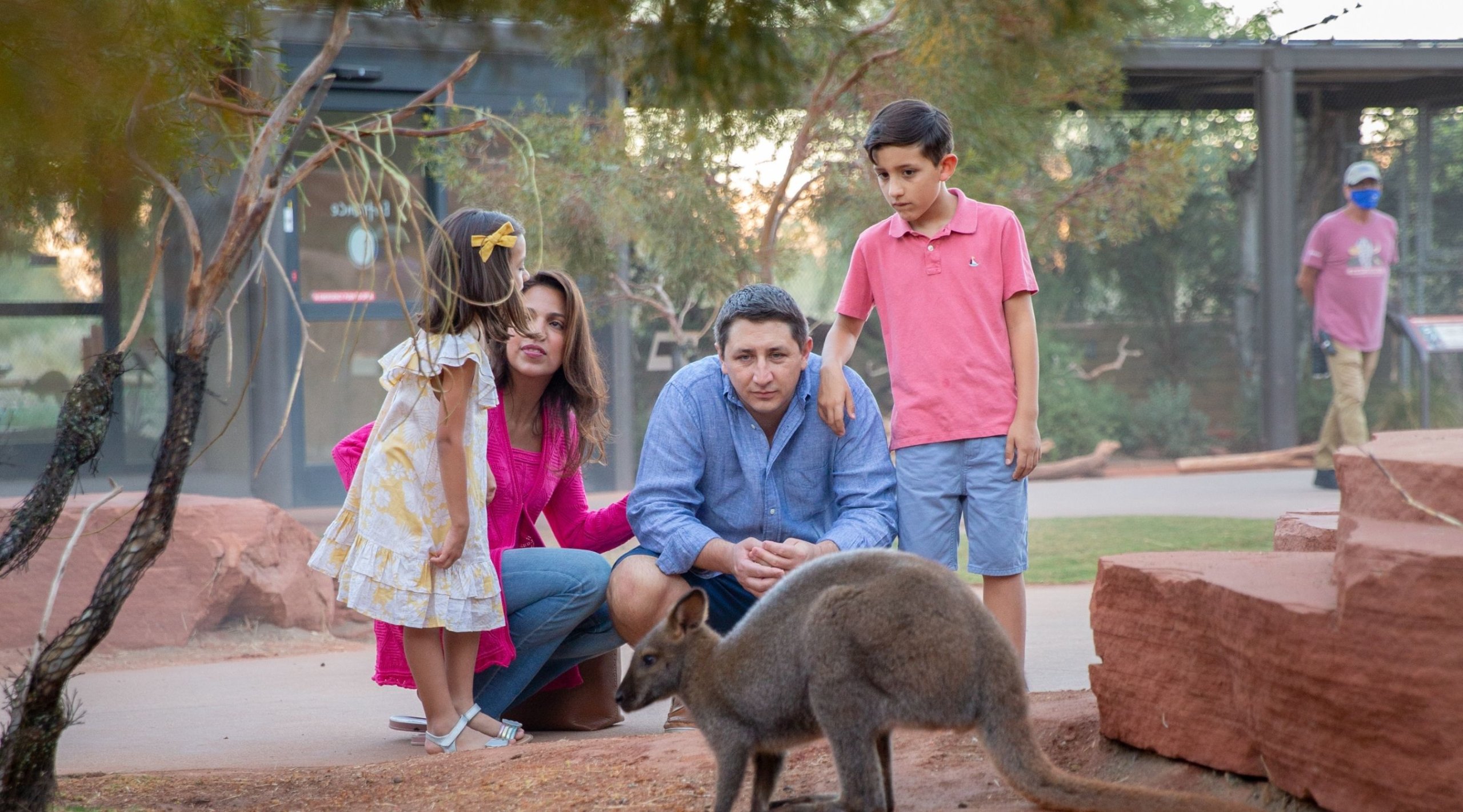 Visit Greater Palm Springs family watching baby kangaroo at the zoo